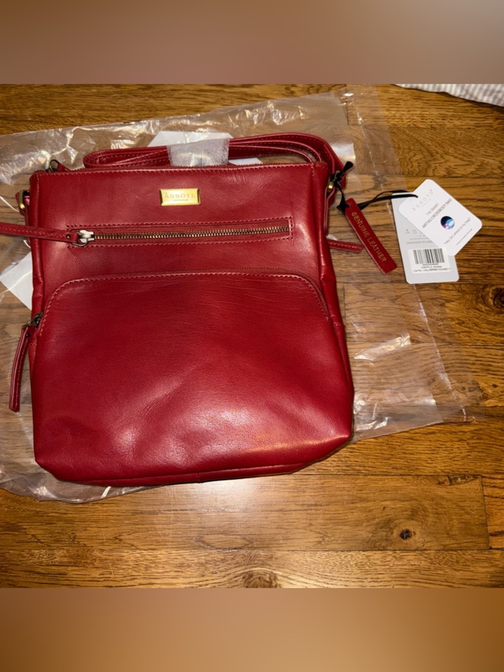 Red Leather Crossbody with Front Zip, Adjustable Strap, and Air Tag Pocket